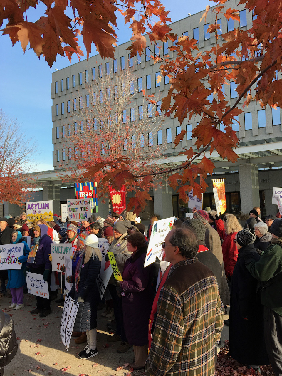 Christians outside the Bishop Henry Whipple Federal Building protesting ICE detentions there.